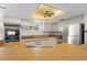 Updated kitchen with stainless steel appliances and light wood cabinets at 3636 Aruba Ct, Punta Gorda, FL 33950