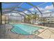 Inviting screened pool area with canal views; perfect for relaxation and entertaining at 3636 Aruba Ct, Punta Gorda, FL 33950