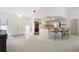 Kitchen with breakfast bar, double doors, and view of living room at 3636 Aruba Ct, Punta Gorda, FL 33950