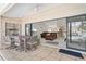 Covered patio with table and chairs, view of living room at 3636 Aruba Ct, Punta Gorda, FL 33950