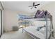 Bright bedroom with a bunk bed and water views at 3636 Aruba Ct, Punta Gorda, FL 33950