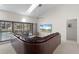 Living area with sectional sofa, large TV, and stunning water views at 3636 Aruba Ct, Punta Gorda, FL 33950