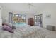 Main bedroom with water views and sliding glass doors leading to the pool at 3636 Aruba Ct, Punta Gorda, FL 33950