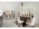 Spacious dining area with a dark wood table and seating for six at 3636 Aruba Ct, Punta Gorda, FL 33950