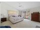 Spacious main bedroom with pool view and large sliding glass doors at 3636 Aruba Ct, Punta Gorda, FL 33950