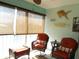 Relaxing sunroom with wicker furniture and decorative accents at 5725 Greenwood Ave # 4, North Port, FL 34287