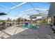 Enclosed pool area with patio and water feature at 941 Don Juan Ct, Punta Gorda, FL 33950