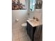 Clean bathroom with updated vanity and tiled floors at 21451 Glendale Ave, Port Charlotte, FL 33952