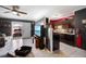 Open concept kitchen with dark cabinets and a breakfast bar at 21451 Glendale Ave, Port Charlotte, FL 33952