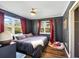 Spacious primary bedroom with a king-size bed and wood flooring at 21451 Glendale Ave, Port Charlotte, FL 33952
