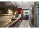 Modern kitchen with dark cabinets, granite countertop at 21451 Glendale Ave, Port Charlotte, FL 33952