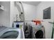 Laundry room with washer, dryer, and water heater at 21451 Glendale Ave, Port Charlotte, FL 33952