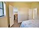 Bedroom with walk-in closet and wood-look floors at 1256 Alton Rd, Port Charlotte, FL 33952