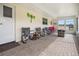 Relaxing screened porch with brick pavers and fire pit at 197 Norfolk Ave Nw, Port Charlotte, FL 33952