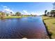 Scenic canal view with lush landscaping and calm waters at 72 Boundary Blvd # 217, Rotonda West, FL 33947