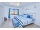 Bright bedroom with a king-size bed and tiled floors at 72 Boundary Blvd # 217, Rotonda West, FL 33947