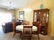 Dining room with hutch and table for four at 5725 Greenwood Ave # 4, North Port, FL 34287
