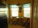 Bright kitchen nook with window seating and a small table at 5725 Greenwood Ave # 4, North Port, FL 34287