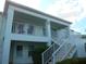 Two-story building with a balcony and stairs at 5725 Greenwood Ave # 4, North Port, FL 34287