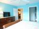 Bright bedroom with double bed, dresser, and access to other rooms at 5725 Greenwood Ave # 4, North Port, FL 34287