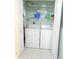 Convenient laundry room with washer, dryer, and shelving at 5725 Greenwood Ave # 4, North Port, FL 34287