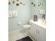 Bathroom with toilet, sink, and decorative wall art at 5725 Greenwood Ave # 4, North Port, FL 34287