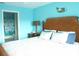 Spacious bedroom with king-size bed and access to bathroom at 5725 Greenwood Ave # 4, North Port, FL 34287