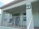 Building exterior featuring a balcony with seating at 5725 Greenwood Ave # 4, North Port, FL 34287