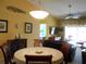 Round dining table with seating for four in the dining room at 5725 Greenwood Ave # 4, North Port, FL 34287