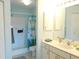 Clean bathroom with shower/tub combo and double vanity at 5725 Greenwood Ave # 4, North Port, FL 34287