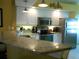 Kitchen with granite countertops and stainless steel appliances at 5725 Greenwood Ave # 4, North Port, FL 34287