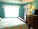 Main bedroom with king bed and ensuite bathroom at 5725 Greenwood Ave # 4, North Port, FL 34287