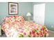 Bedroom with floral bedding, nightstand, and closet at 5725 Greenwood Ave # 4, North Port, FL 34287