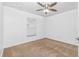 Simple bedroom with neutral carpeting and a window with blinds at 5895 Bannock Cir, North Port, FL 34288