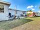 Spacious backyard with patio, grill, shed, and grassy area at 21524 Edgewater Dr, Port Charlotte, FL 33952