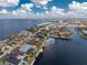 Aerial view of a waterfront home with a pool and private dock at 1945 Jamaica Way, Punta Gorda, FL 33950