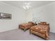 Charming bedroom with two twin beds, window with shutters and ceiling fan at 1945 Jamaica Way, Punta Gorda, FL 33950