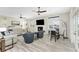 Relaxing living room featuring a sectional sofa, fireplace, and large windows at 1945 Jamaica Way, Punta Gorda, FL 33950