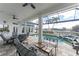Spacious covered patio, offering comfortable seating and pool access at 1945 Jamaica Way, Punta Gorda, FL 33950