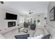 Comfortable living room with sectional sofa, fireplace, and pool view at 1945 Jamaica Way, Punta Gorda, FL 33950