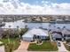 Aerial view of a waterfront house with a metal roof and boat slip at 1945 Jamaica Way, Punta Gorda, FL 33950