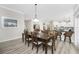 Bright dining room with hardwood floors and a large table, perfect for Gathering gatherings at 1945 Jamaica Way, Punta Gorda, FL 33950