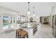 Gourmet kitchen with island, stainless steel appliances, and granite countertops at 1945 Jamaica Way, Punta Gorda, FL 33950