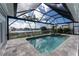 Relaxing screened pool and spa with water views at 1945 Jamaica Way, Punta Gorda, FL 33950