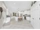 Modern kitchen with white cabinets, granite countertops, and stainless steel appliances at 1945 Jamaica Way, Punta Gorda, FL 33950