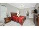 Bright bedroom with king bed, hardwood floors and ensuite bathroom access at 1945 Jamaica Way, Punta Gorda, FL 33950