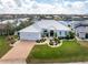 Luxury waterfront home with a metal roof, spacious driveway, and lush landscaping at 1945 Jamaica Way, Punta Gorda, FL 33950