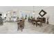 Spacious dining area with a large table and access to the kitchen and patio at 1945 Jamaica Way, Punta Gorda, FL 33950