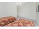 Spacious bedroom with two twin beds and built-in closet at 1945 Jamaica Way, Punta Gorda, FL 33950
