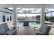 Serene patio with pool views and comfortable seating for relaxation at 1945 Jamaica Way, Punta Gorda, FL 33950